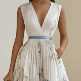Camilla | Abito midi plissettato in chiffon bianco a fiori con scollo a V